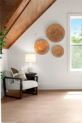 a white bath tub sitting in a bathroom next to a window