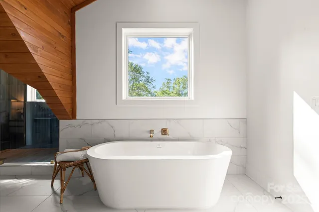 a room with a sink vanity and mirror