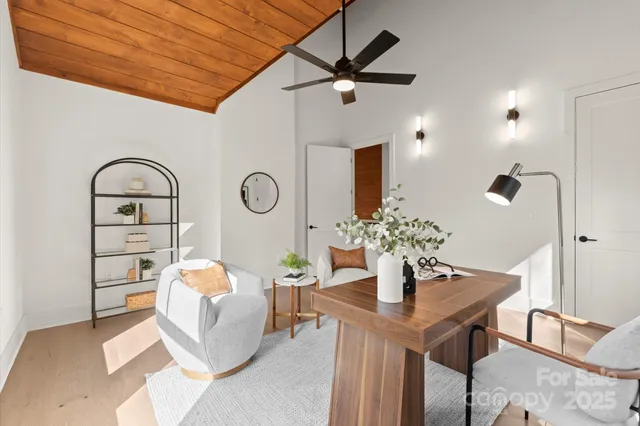 a view of an empty room with a kitchen