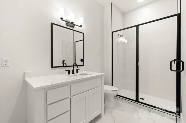 a view of a livingroom with a ceiling fan and window