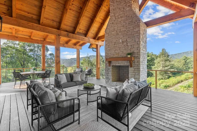 a view of a house with backyard porch and sitting area