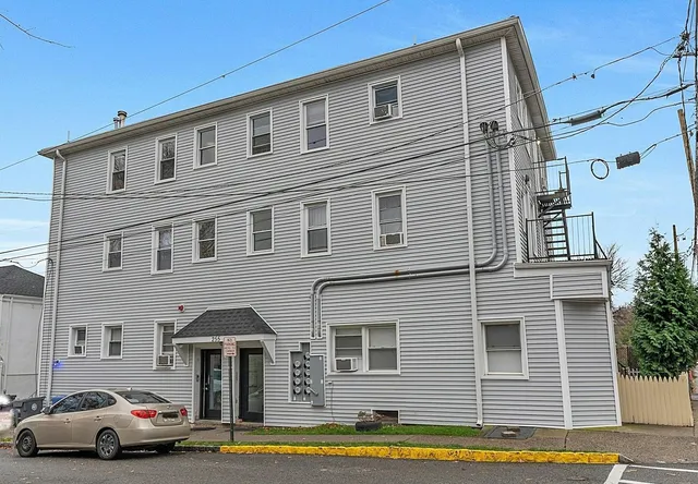 a view of a car park in front of house