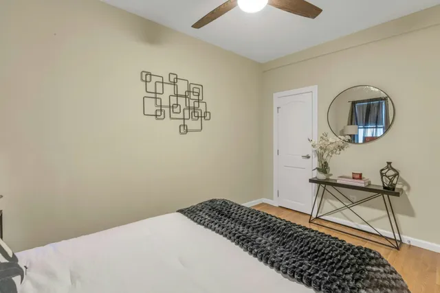 a bedroom with a bed and a table