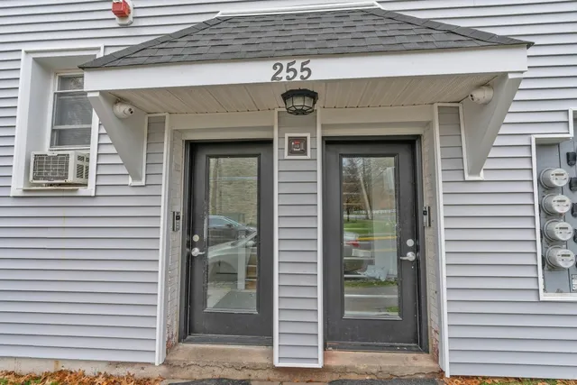 a front view of a house with glass windows
