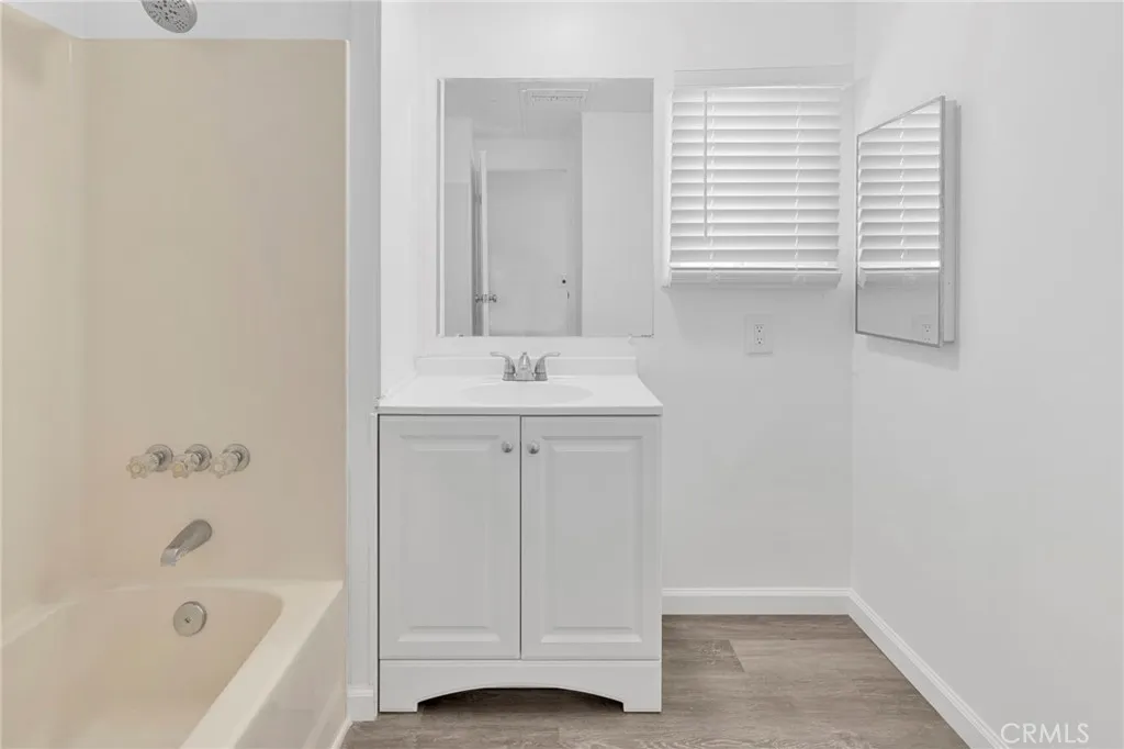 15252 Seneca Road, Unit 161 Victorville, CA 92392 - Photo 11 of 18 a bathroom with a sink and a bathtub