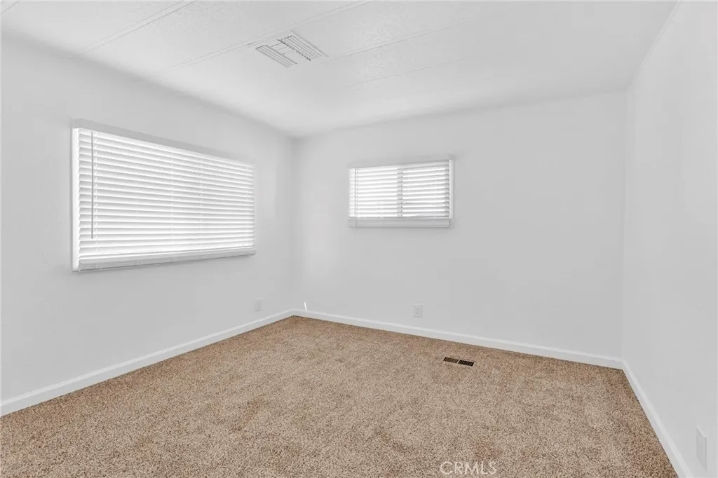 15252 Seneca Road, Unit 161 Victorville, CA 92392 - Photo 14 of 18 an empty room with a window