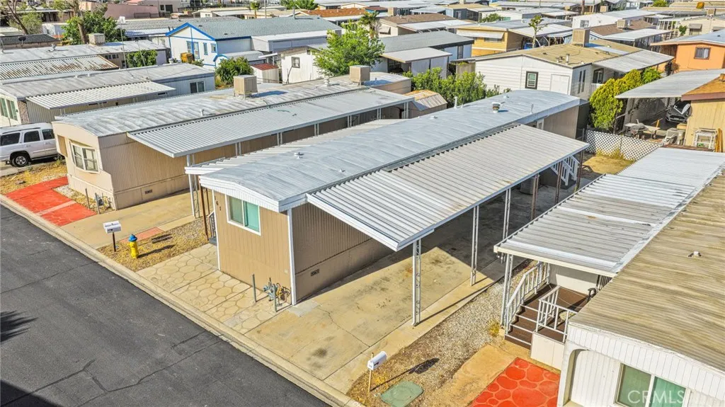 15252 Seneca Road, Unit 161 Victorville, CA 92392 - Photo 17 of 18 an aerial view of residential houses with outdoor space