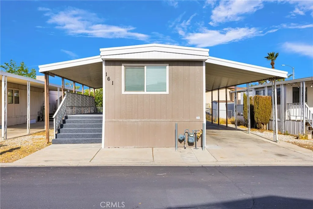 15252 Seneca Road, Unit 161 Victorville, CA 92392 - Photo 2 of 18 a front view of a house