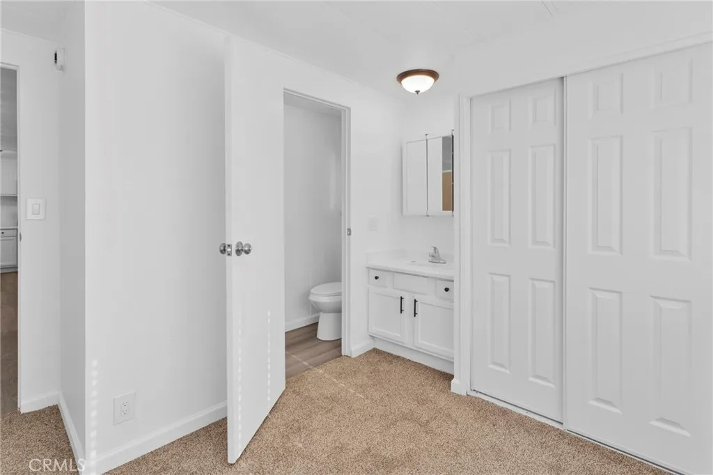 15252 Seneca Road, Unit 161 Victorville, CA 92392 - Photo 8 of 18 a bathroom with white walls