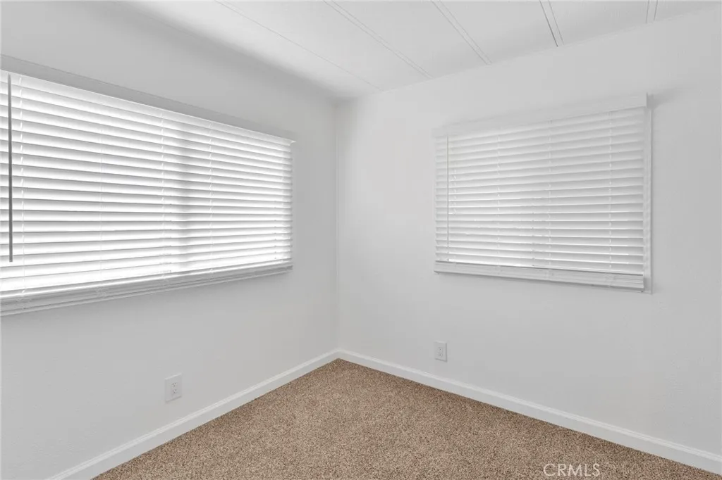 15252 Seneca Road, Unit 161 Victorville, CA 92392 - Photo 9 of 18 an empty room with a window
