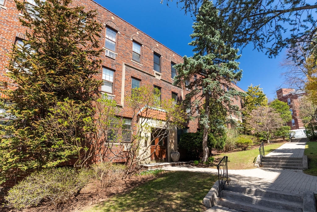 a view of a building with a tree