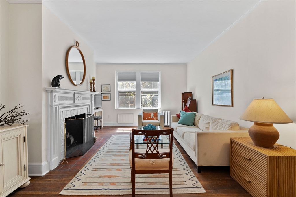 321 Tappan Street, Unit 1 Brookline, MA 02445 - Photo 8 of 31 a living room with furniture and a fireplace