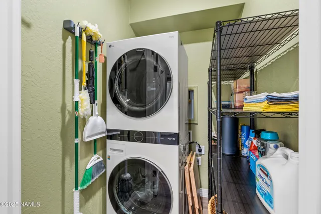 a view of a bedroom with washer and dryer