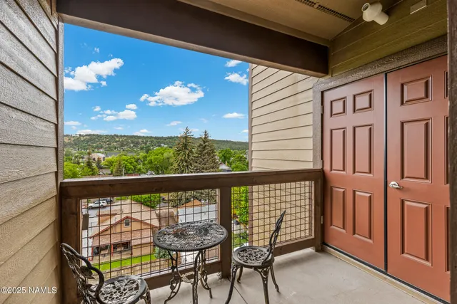 a view of a porch with furniture and garden