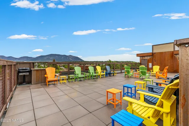 a view of a swimming pool and lounge chairs