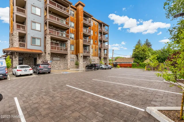 a view of a street with a building in the background