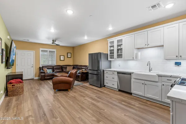 a kitchen with sink refrigerator and stove