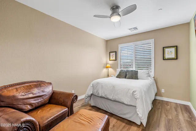a bedroom with furniture and a window