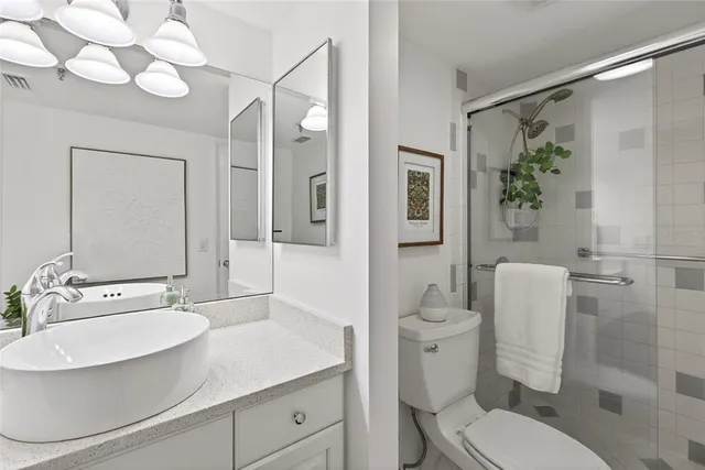 a front view of a house with swimming pool and porch