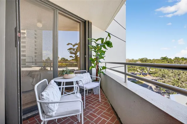 a view of a swimming pool with a table and chairs