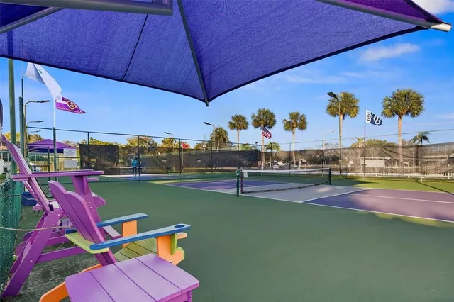 a living room with furniture and large windows