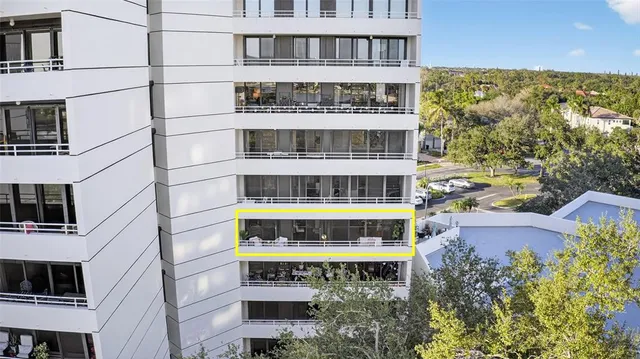 a kitchen with stainless steel appliances granite countertop a sink and a refrigerator