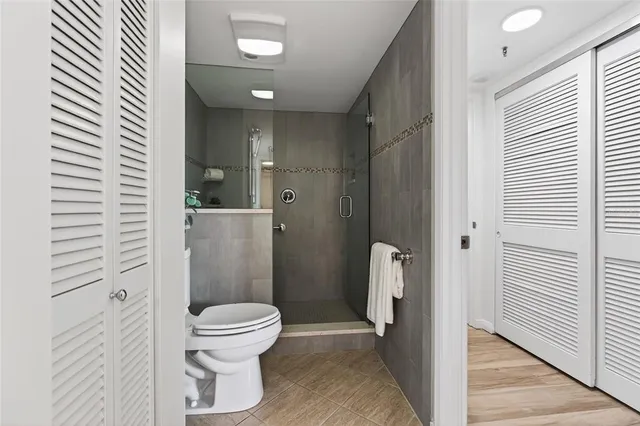 a view of a chairs and table in the balcony