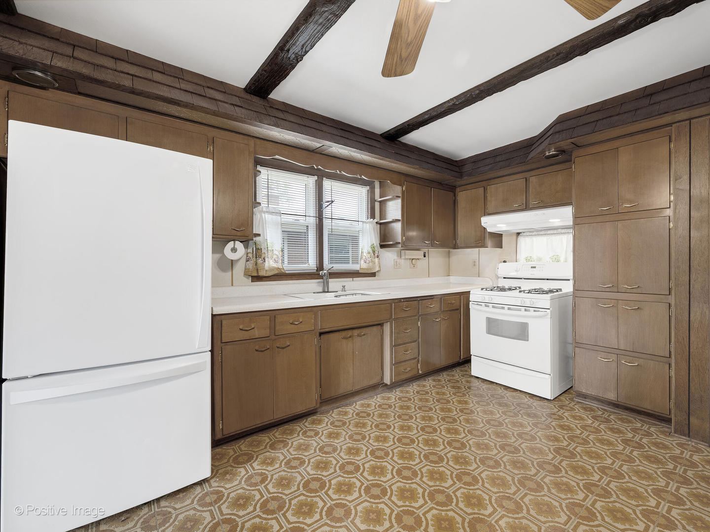 5102 Butterfield Road Hillside, IL 60162 - Photo 6 of 22 a kitchen with a stove sink and refrigerator