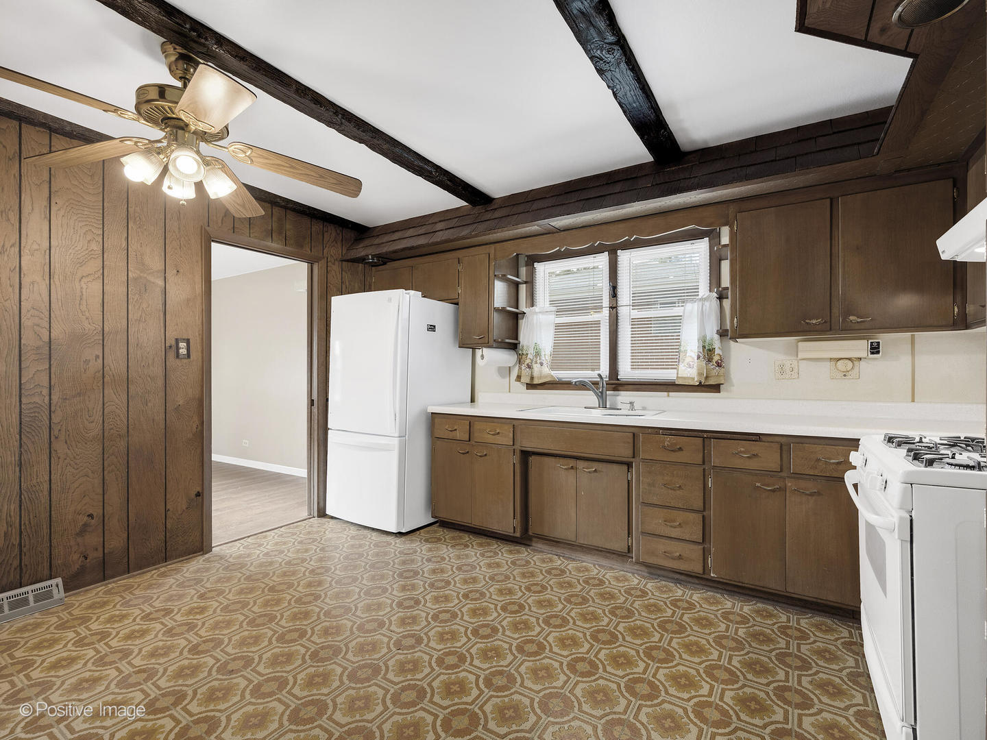 5102 Butterfield Road Hillside, IL 60162 - Photo 7 of 22 a kitchen with a refrigerator a sink and cabinets