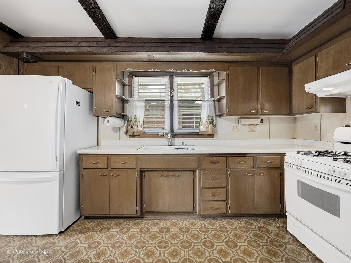 5102 Butterfield Road Hillside, IL 60162 - Photo 8 of 22 a kitchen with stainless steel appliances granite countertop a sink stove and refrigerator
