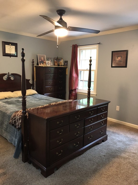 107 Center Depot Road, Unit F Charlton, MA 01507 - Photo 12 of 20 a bed room with a bed and a dresser