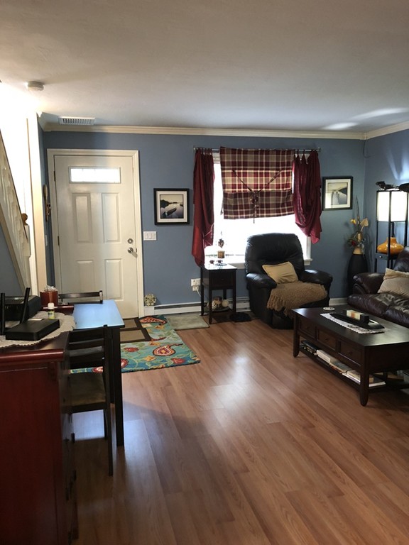107 Center Depot Road, Unit F Charlton, MA 01507 - Photo 3 of 20 a living room with furniture a window and a table