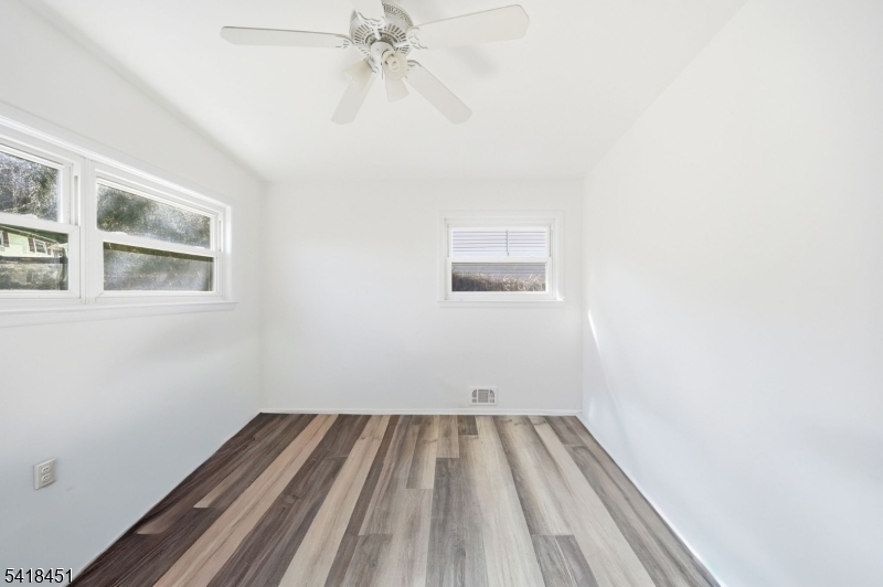 61 Hemlock Road Rockaway, NJ 07866 - Photo 17 of 40 a view of a room with wooden floor and fan