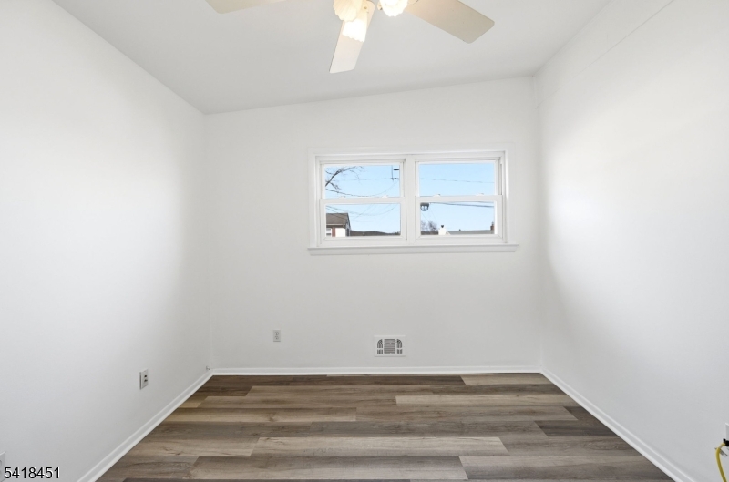 61 Hemlock Road Rockaway, NJ 07866 - Photo 20 of 40 a view of a small space with wooden floor and a window
