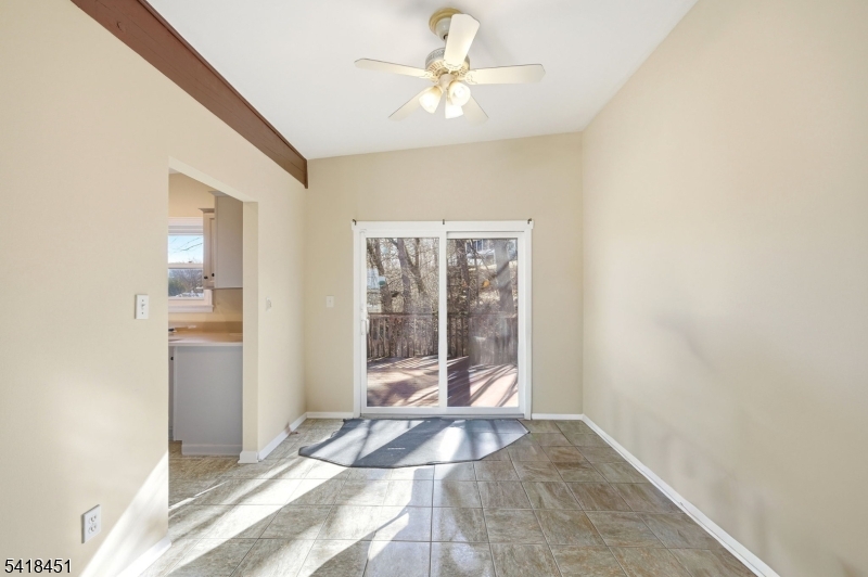 61 Hemlock Road Rockaway, NJ 07866 - Photo 7 of 40 a view of a livingroom with a chandelier fan and a window