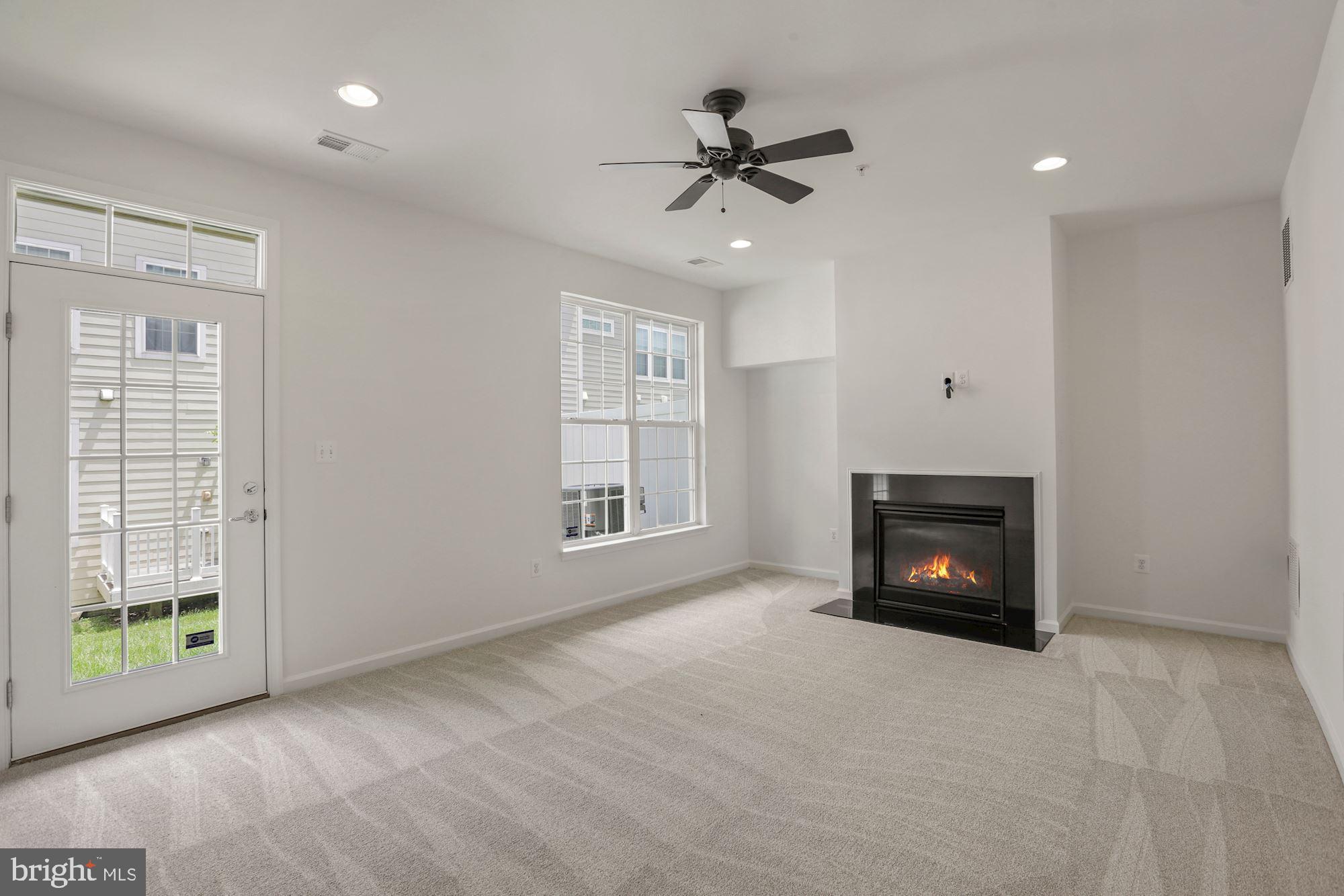 2131 Little Sorrel Way Silver Spring, MD 20902 - Photo 8 of 40 Large flex room w/ fireplace, door to rear yard