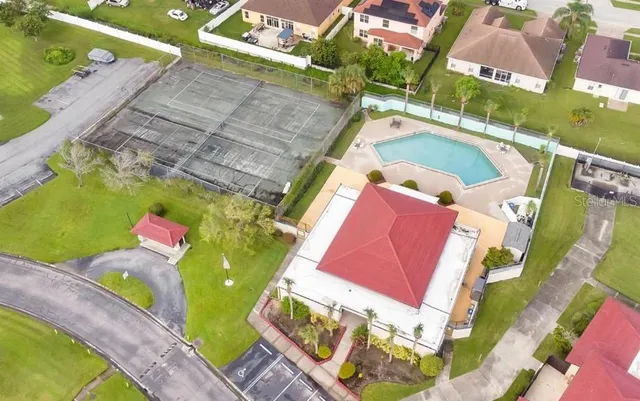 an aerial view of a house with a swimming pool