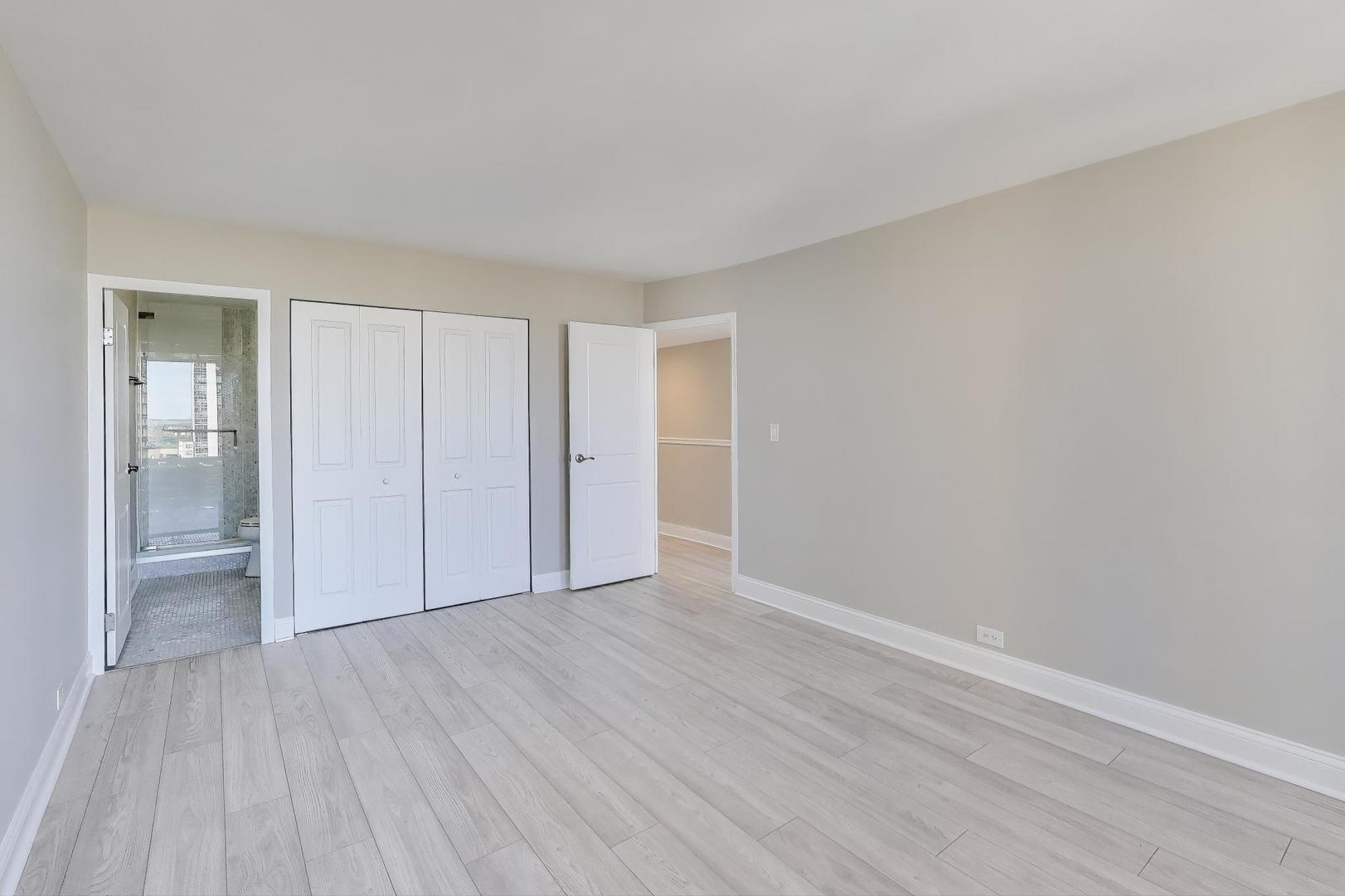 1400 North State Parkway, Unit 18A Chicago, IL 60610 - Photo 13 of 31 a view of an empty room with wooden floor