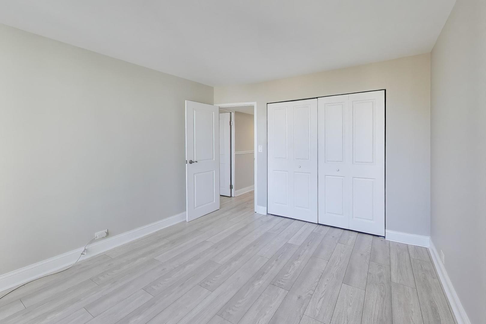 1400 North State Parkway, Unit 18A Chicago, IL 60610 - Photo 15 of 31 a view of an empty room with wooden floor