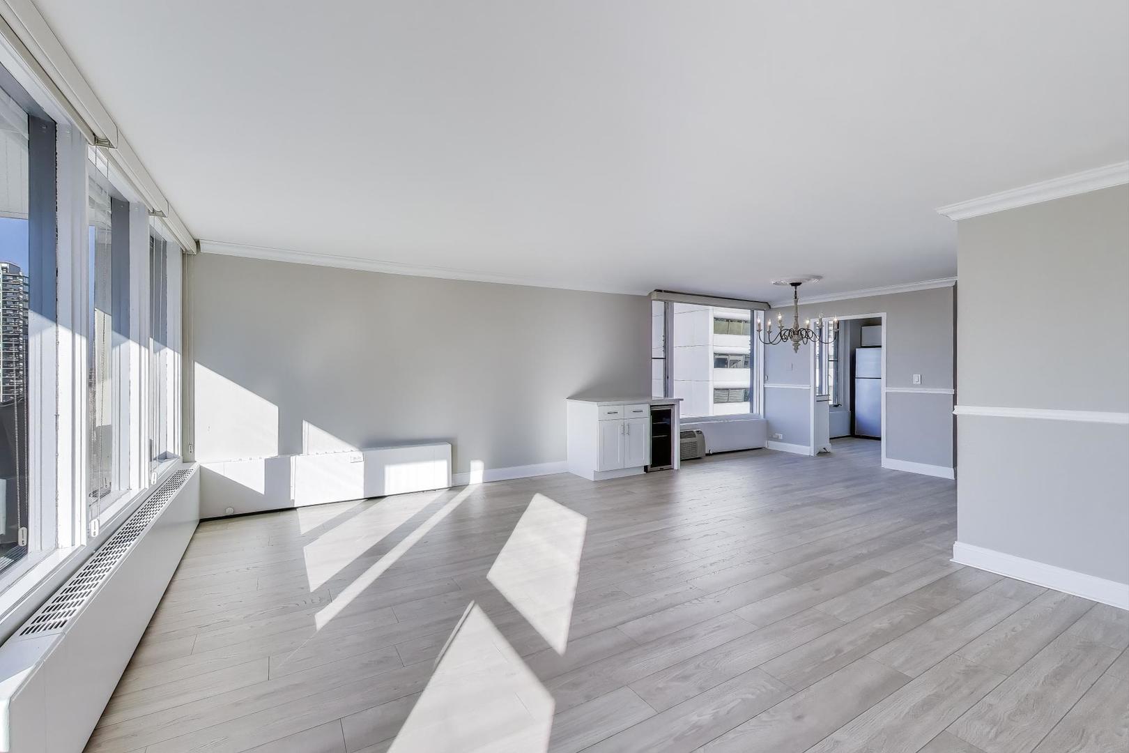 1400 North State Parkway, Unit 18A Chicago, IL 60610 - Photo 2 of 31 a view of empty room with wooden floor