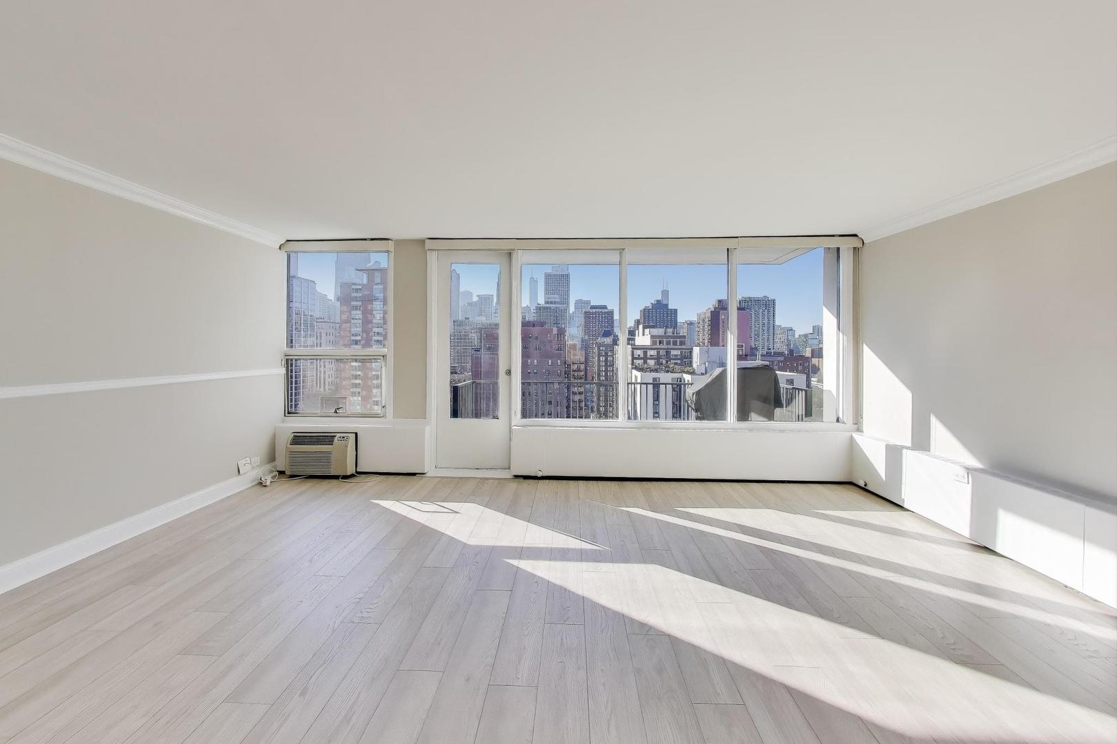 1400 North State Parkway, Unit 18A Chicago, IL 60610 - Photo 3 of 31 an empty room with windows