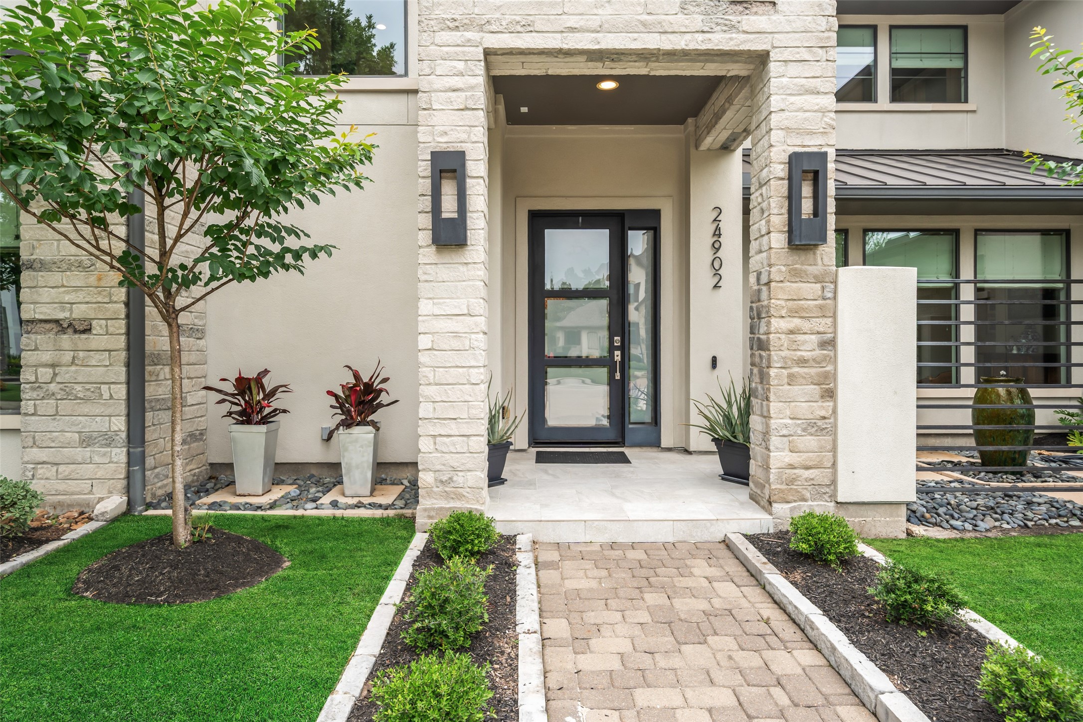 24902 Delaney Knoll Spring, TX 77389 - Photo 44 of 49 a front view of a house with garden