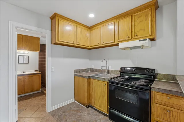 an empty room with window and hallway