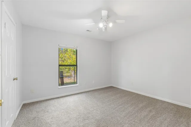 a bathroom with a sink toilet and mirror