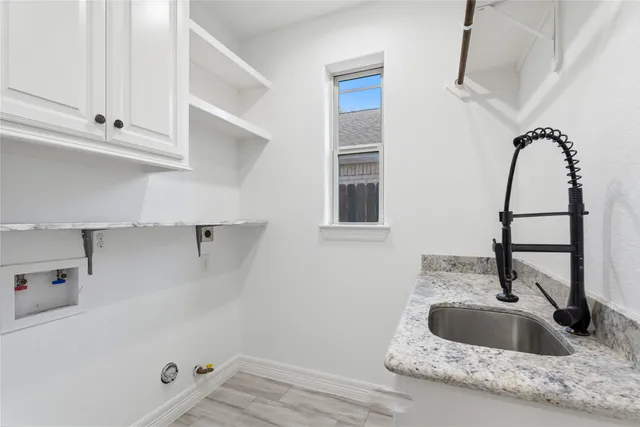 a bathroom with a sink and a window