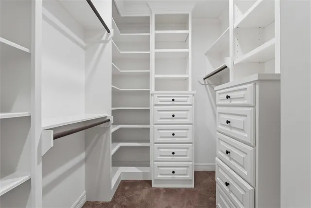 a view of an empty walk in closet