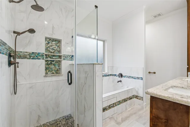 a bathroom with a sink and shower