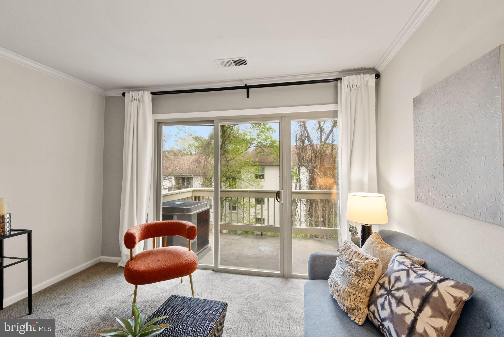 8511 Barrington Court, Unit S Springfield, VA 22152 - Photo 21 of 29 a living room with furniture and a large window