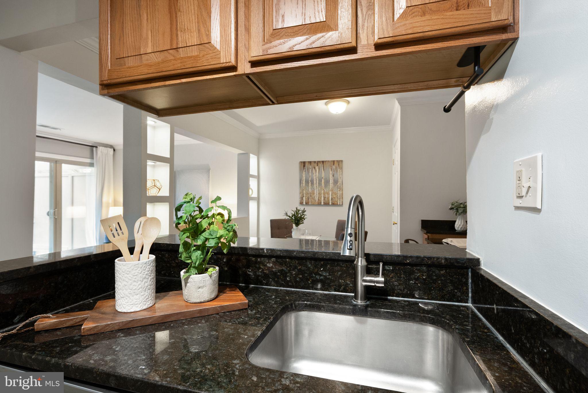 8511 Barrington Court, Unit S Springfield, VA 22152 - Photo 25 of 29 a kitchen with a sink and a stove