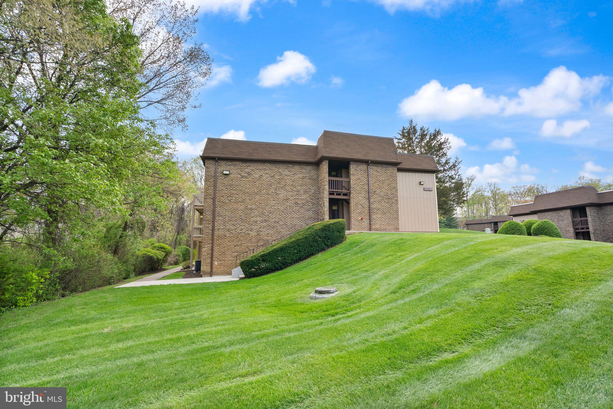 8511 Barrington Court, Unit S Springfield, VA 22152 - Photo 3 of 29 a view of a house with backyard and garden